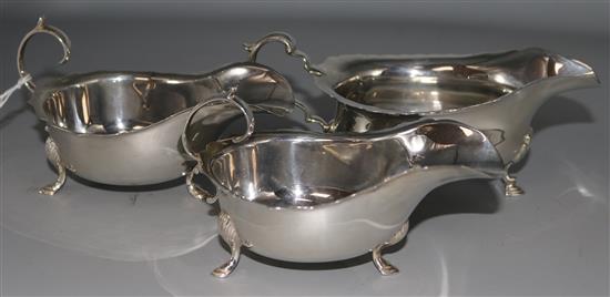A pair of 1930s silver sauceboats by John Round & Son Ltd and one other silver sauceboat by Elkington & Co, 12 oz.